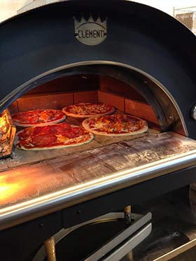 You can cook up to 4 pizza with wood in this house pizza oven